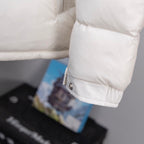 Long Moncler down jacket sleeve cuff with logo patch