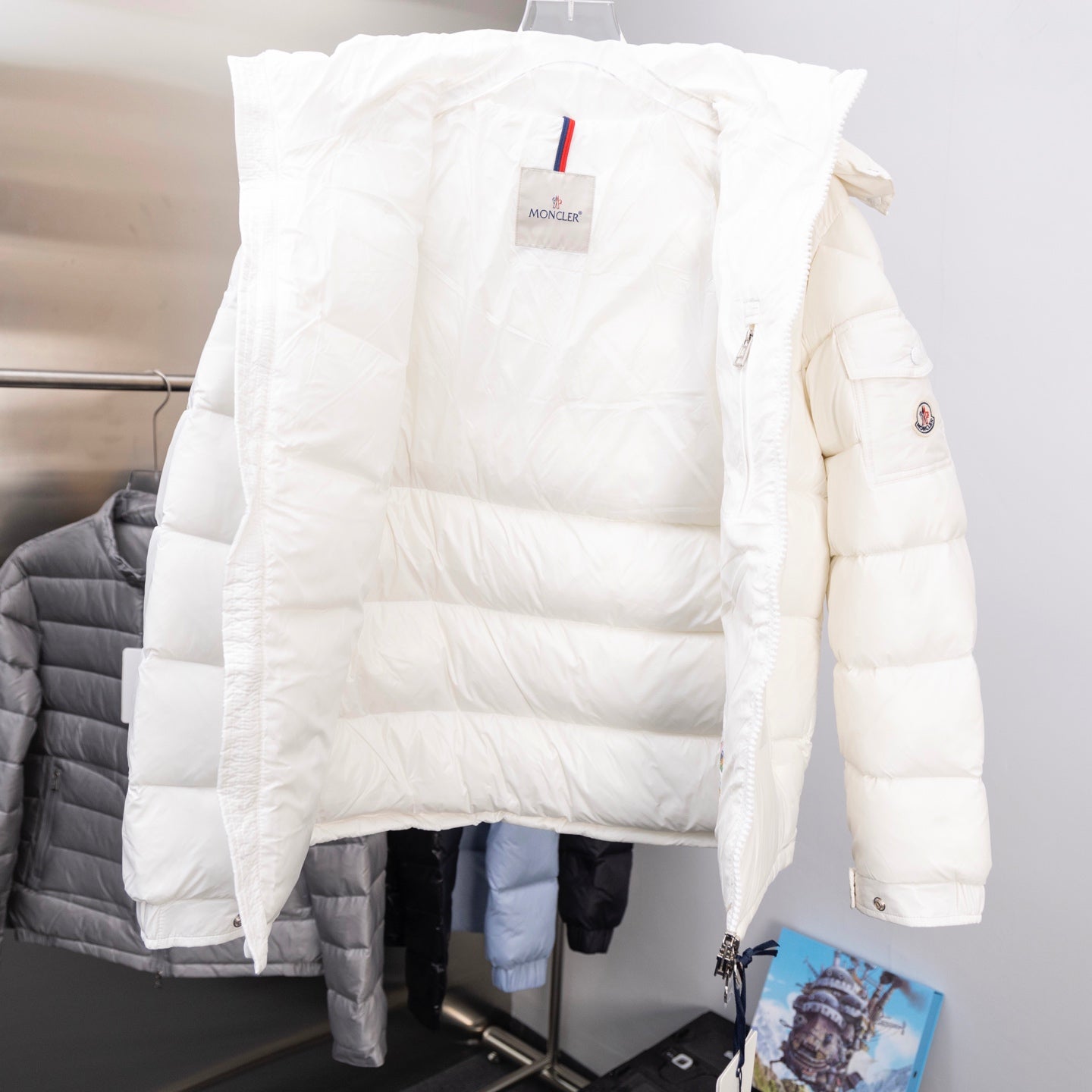 White Moncler long puffer jacket with hood and side logo sleeve patch