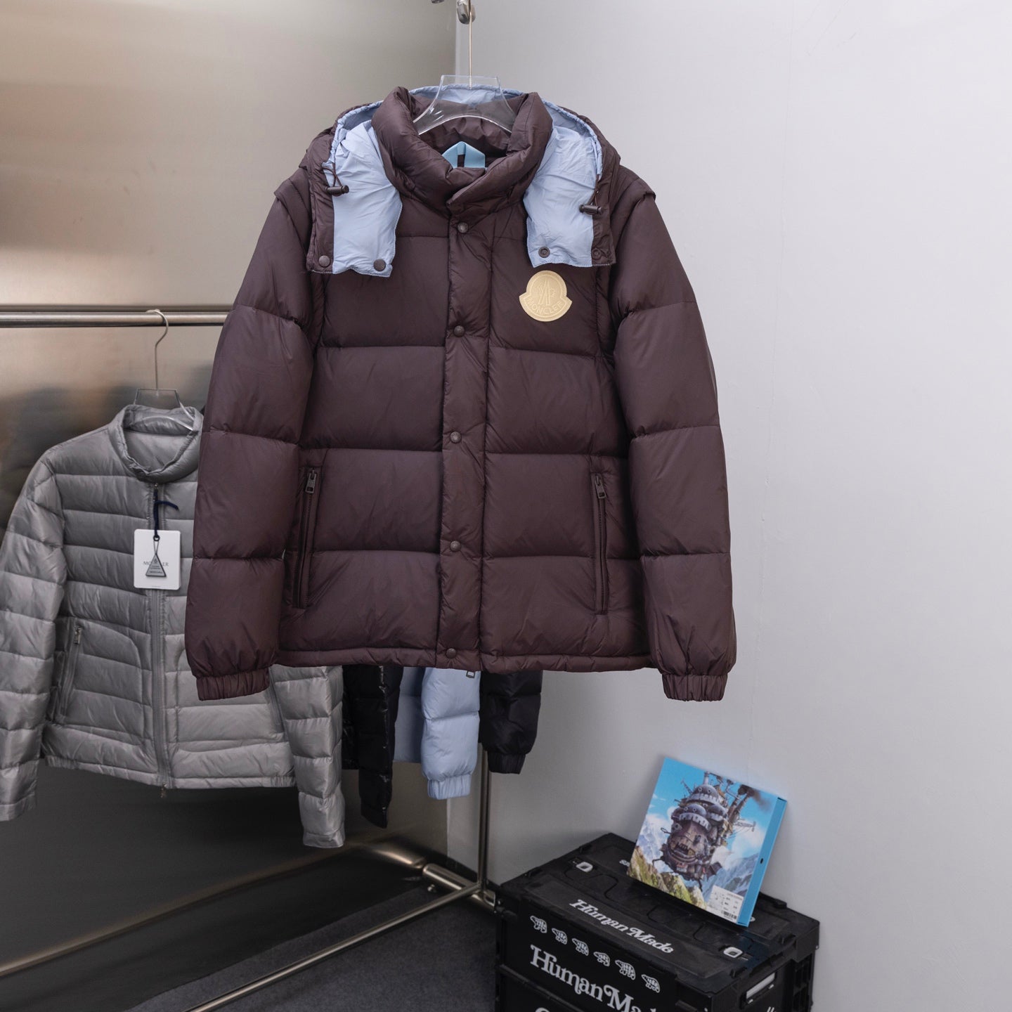Moncler long puffer coat, dark brown with blue hood lining and round logo patch