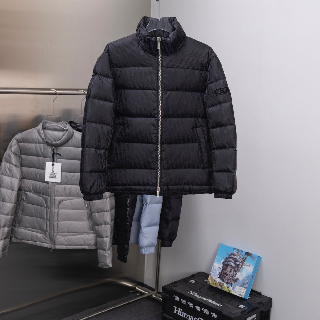 Black Dior long puffer jacket with front zipper and stand collar.
