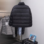Black Dior long puffer jacket, quilted with logo pattern, back view.