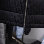 Long dark Dior monogram jacket with full-length front zipper