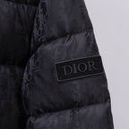 Black Dior puffer jacket chest patch with DIOR logo badge.