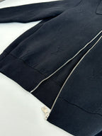 Dark navy zip-up jacket front with silver zipper and ribbed trim detailing