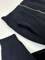 Dark navy knit jacket front panels with ribbed hem and zipper at top edge
