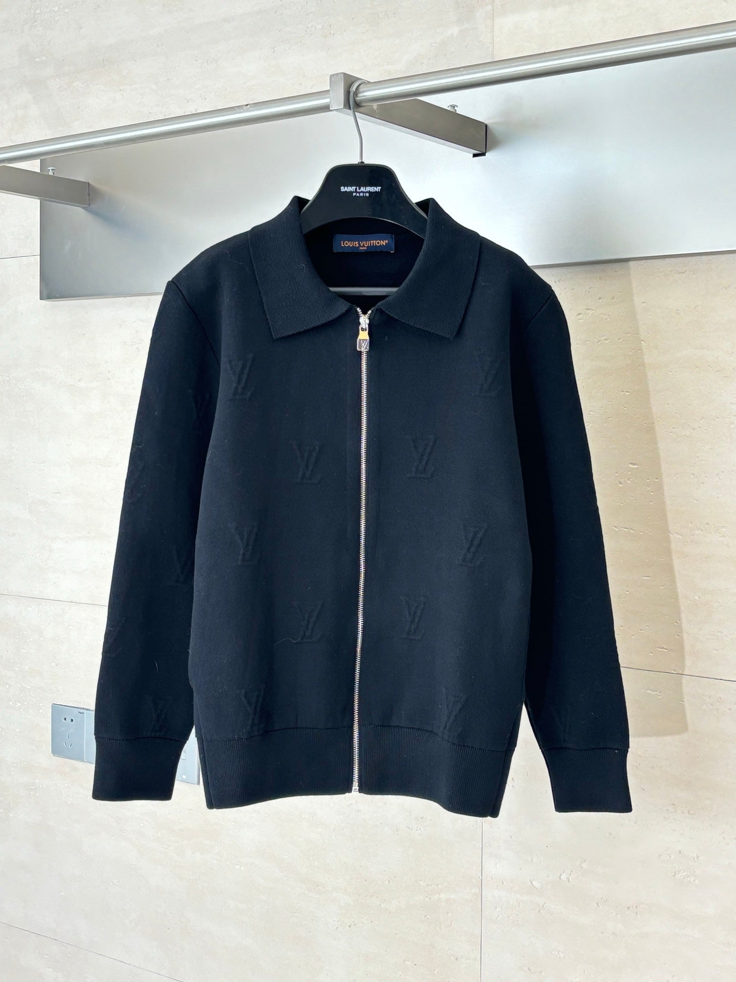 Dark navy zip-up jacket with point collar and silver-tone zipper hardware
