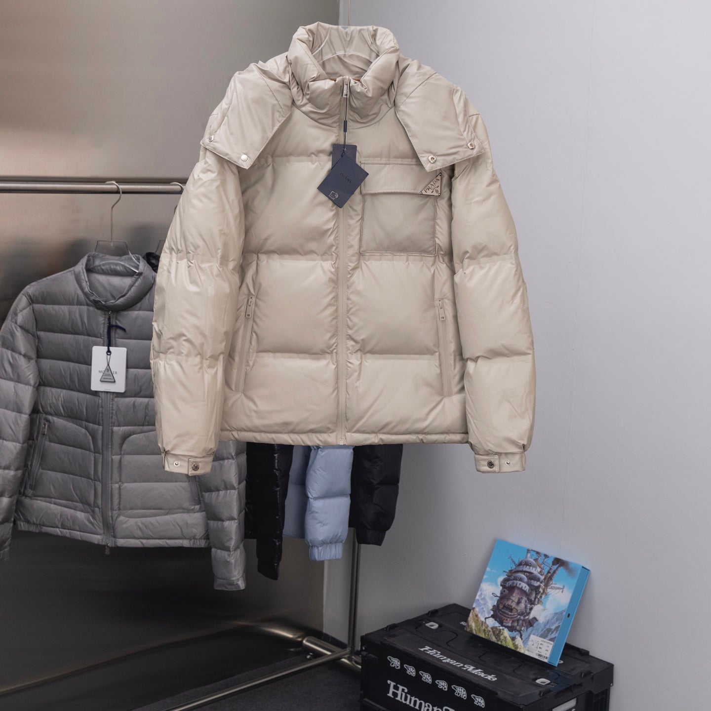 Prada hooded puffer jacket in light beige, full-zip front, quilted baffles