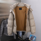 Prada hooded puffer jacket with brown lining visible at open front