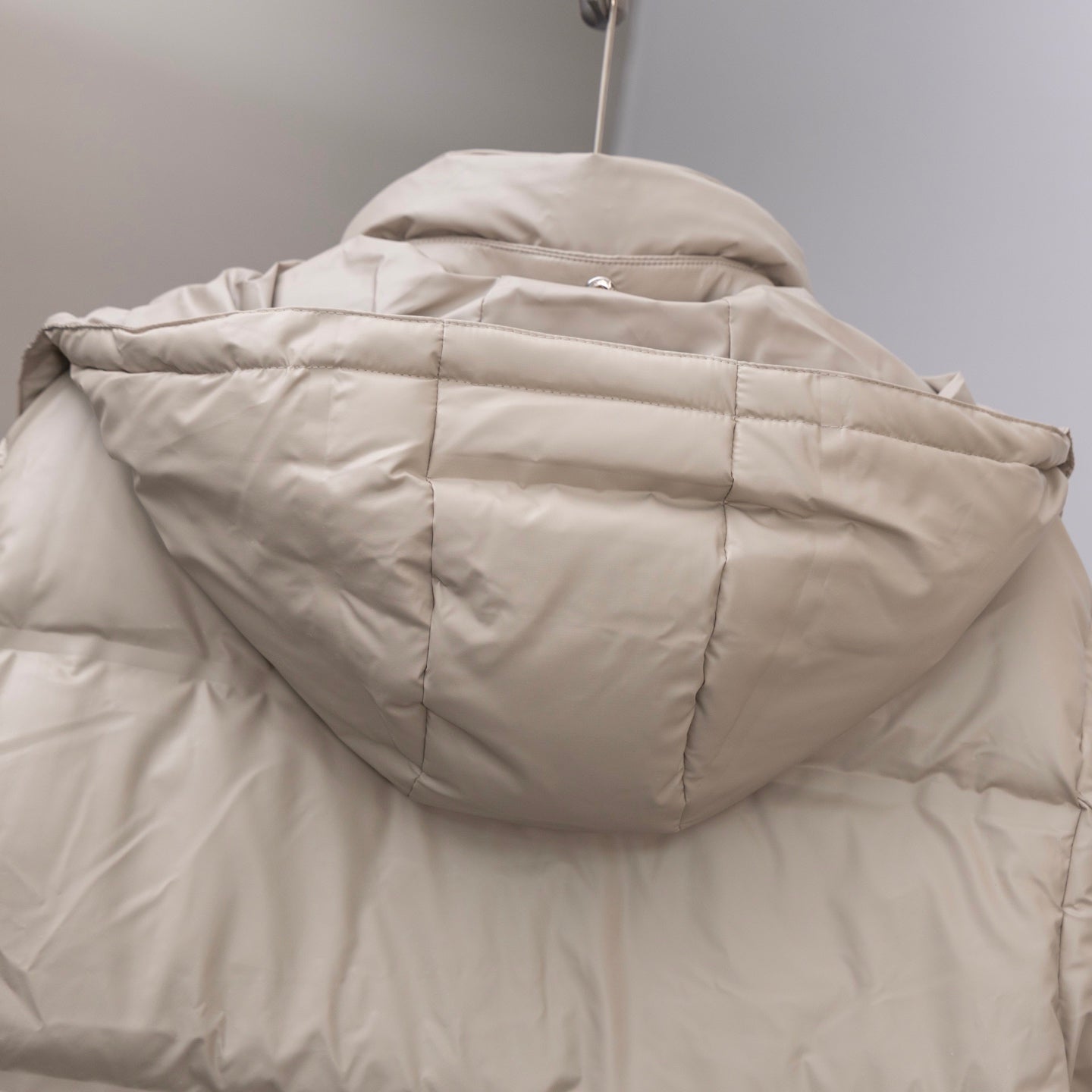 Prada hooded puffer jacket back with stitched panels and raised collar