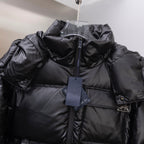 Long puffer jacket in dark, hooded collar with hanging price tag