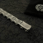 Silver-tone bracelet with rectangular engraved links and an extended clasp plate