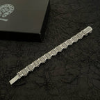 Silver-tone engraved bracelet with rectangular link panels and a bar clasp end