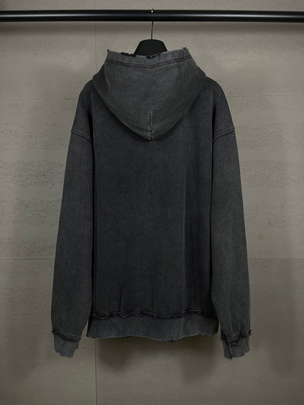 Balenciaga dark zip-up hoodie with hood, back view, ribbed cuffs