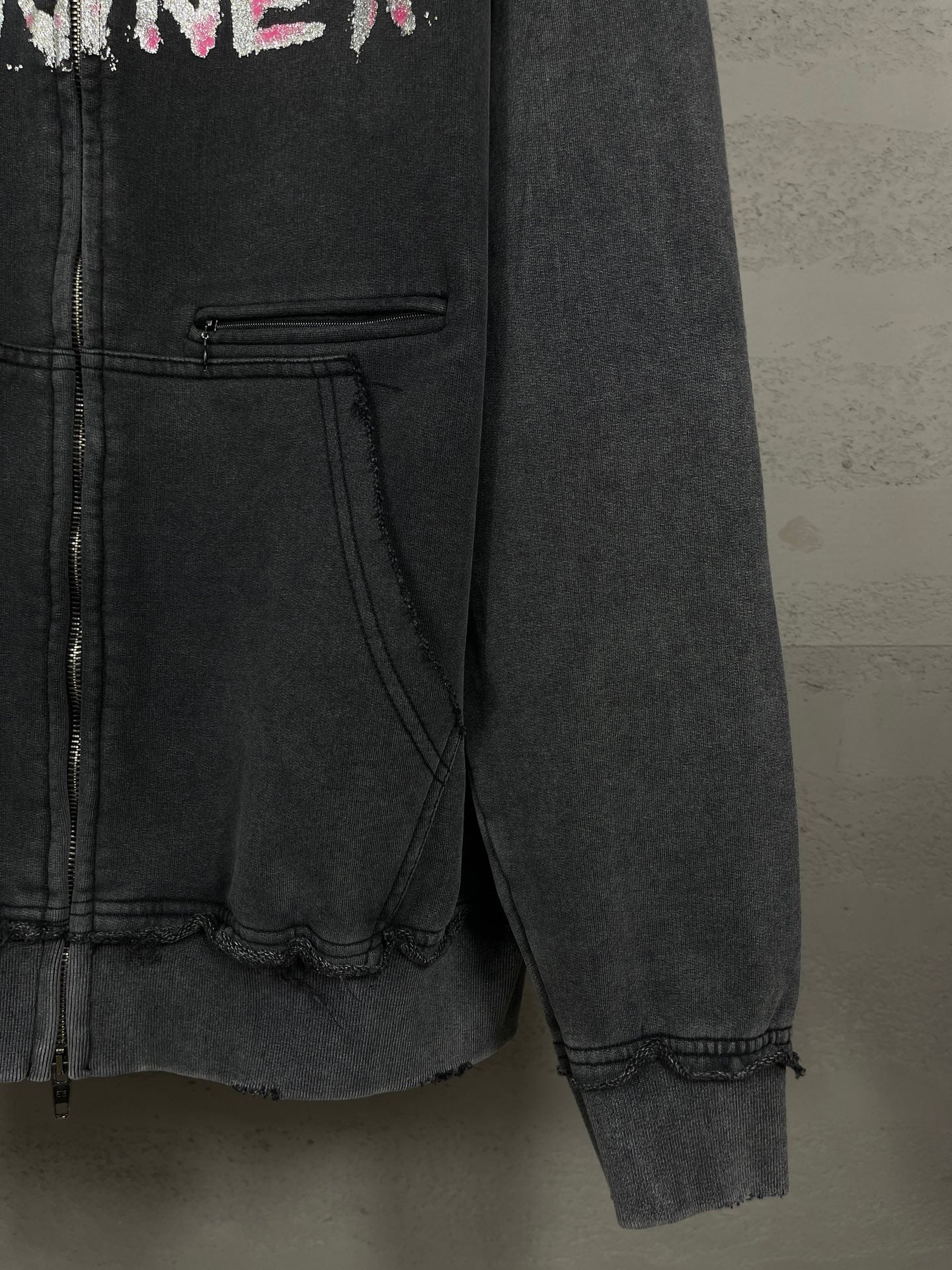 Balenciaga dark zip-up hoodie front pocket detail and distressed hem