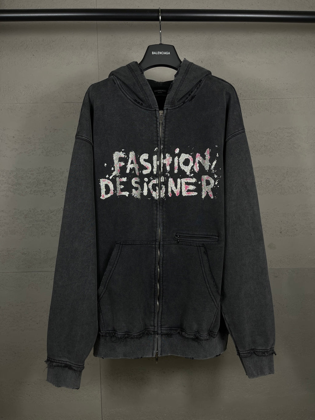 Balenciaga dark zip-up hoodie with hood and 'Fashion Designer' graphic front