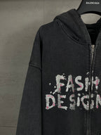 Balenciaga dark zip-up hoodie with hood and 'Fashion Designer' graphic across chest