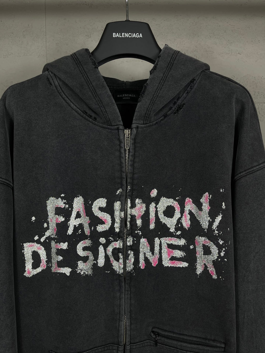 Balenciaga dark zip-up hoodie with hood and front 'Fashion Designer' graphic