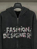 Balenciaga dark zip-up hoodie with hood and front 'Fashion Designer' graphic