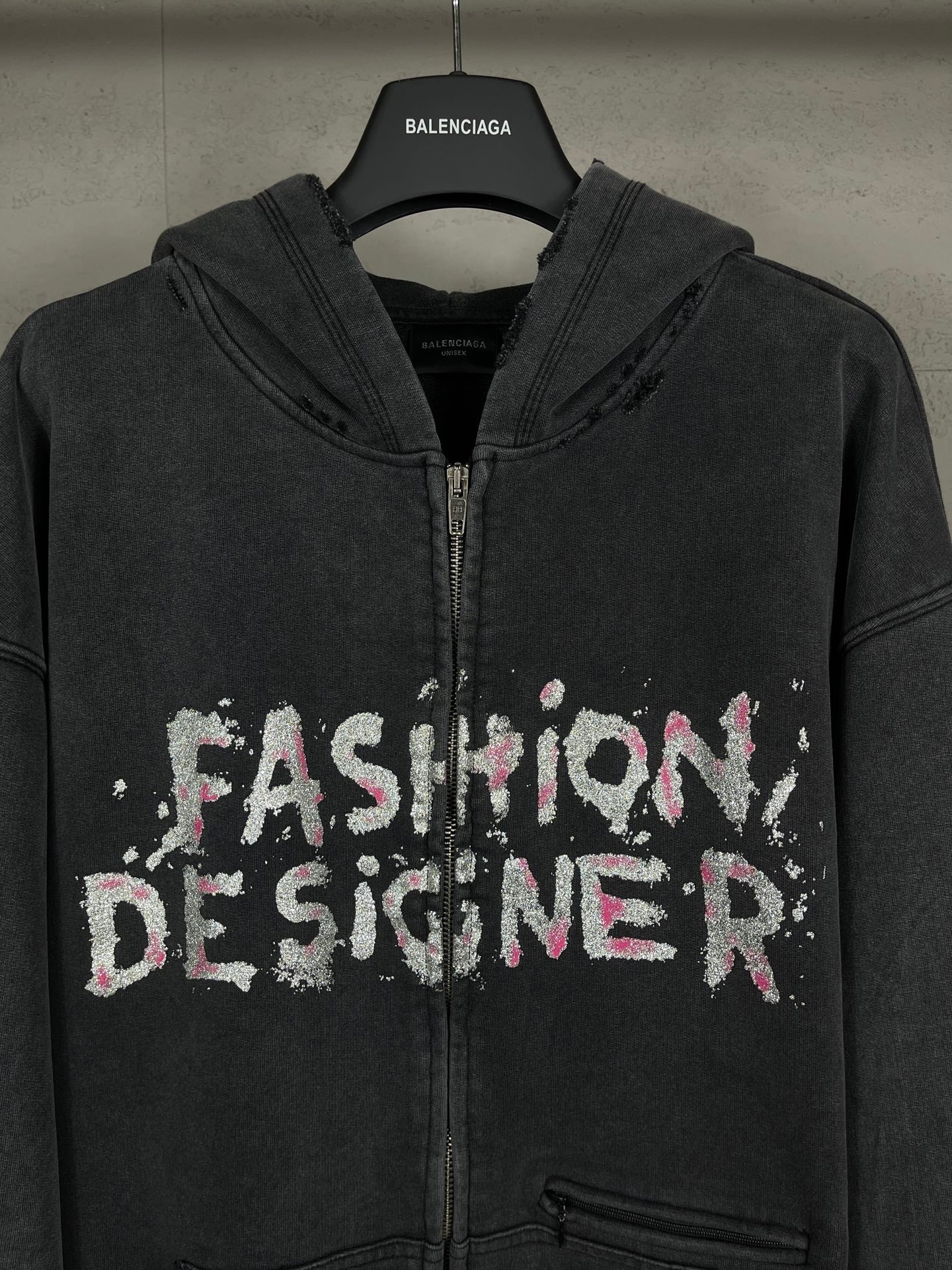 Balenciaga dark zip-up hoodie with hood and front 'Fashion Designer' graphic