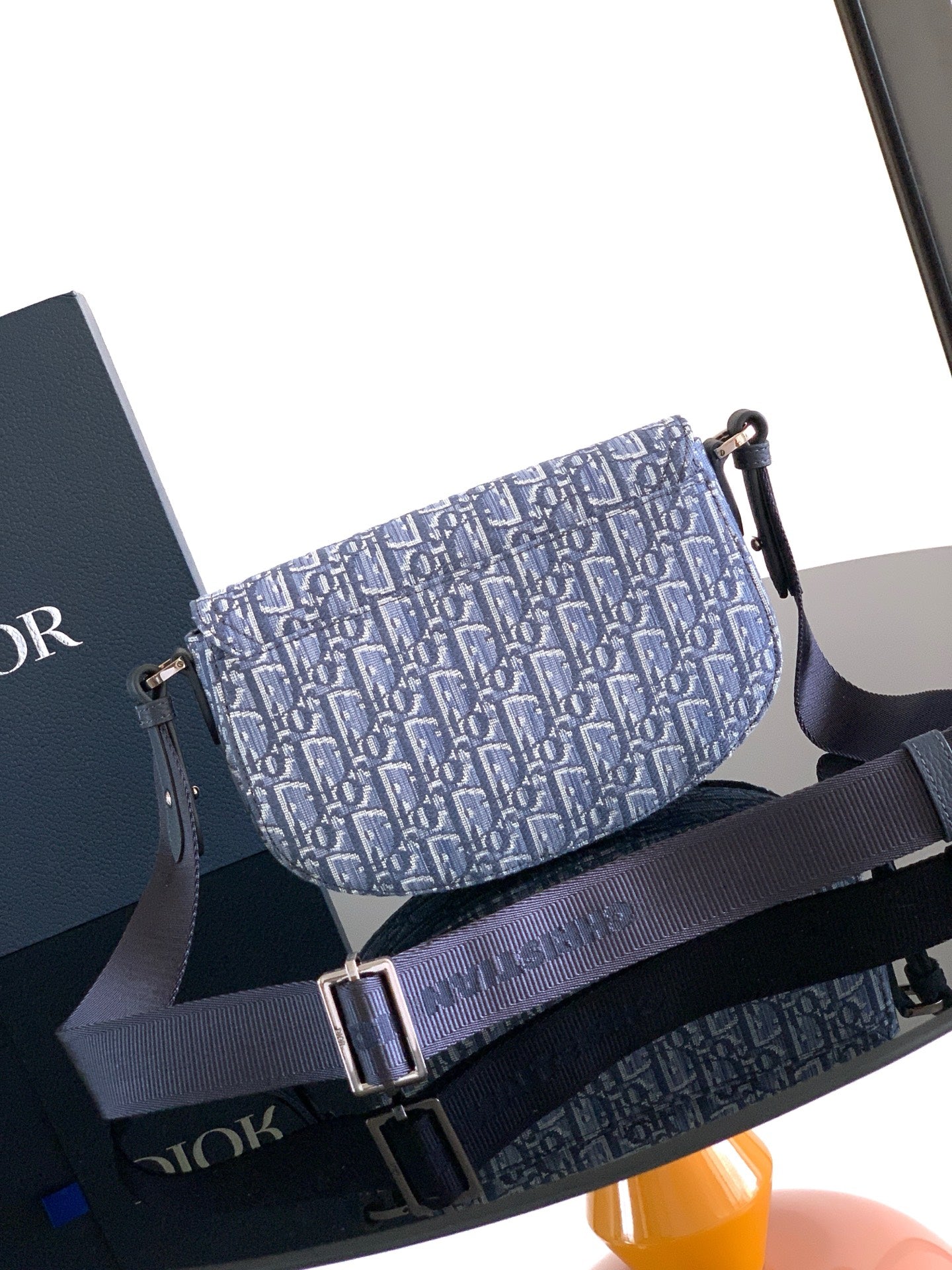 Dior men's crossbody bag with blue monogram fabric and adjustable web strap