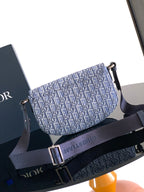 Dior shoulder bag with curved flap and adjustable strap, blue monogram canvas