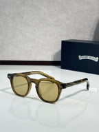 Tortoise-brown round sunglasses with tan lenses and gold-tone hardware