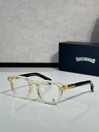 Clear gold-tone round eyeglasses with transparent lenses and metal temples