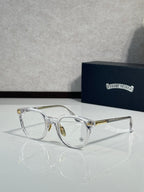 Silver round eyeglass frames with tinted lenses and gold-tone temples