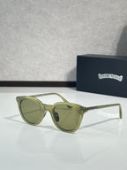 Olive green round eyeglass frames with tinted lenses and gold-tone temples