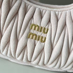 Light pink matelasse handbag with embroidered gold-tone “miu miu” logo