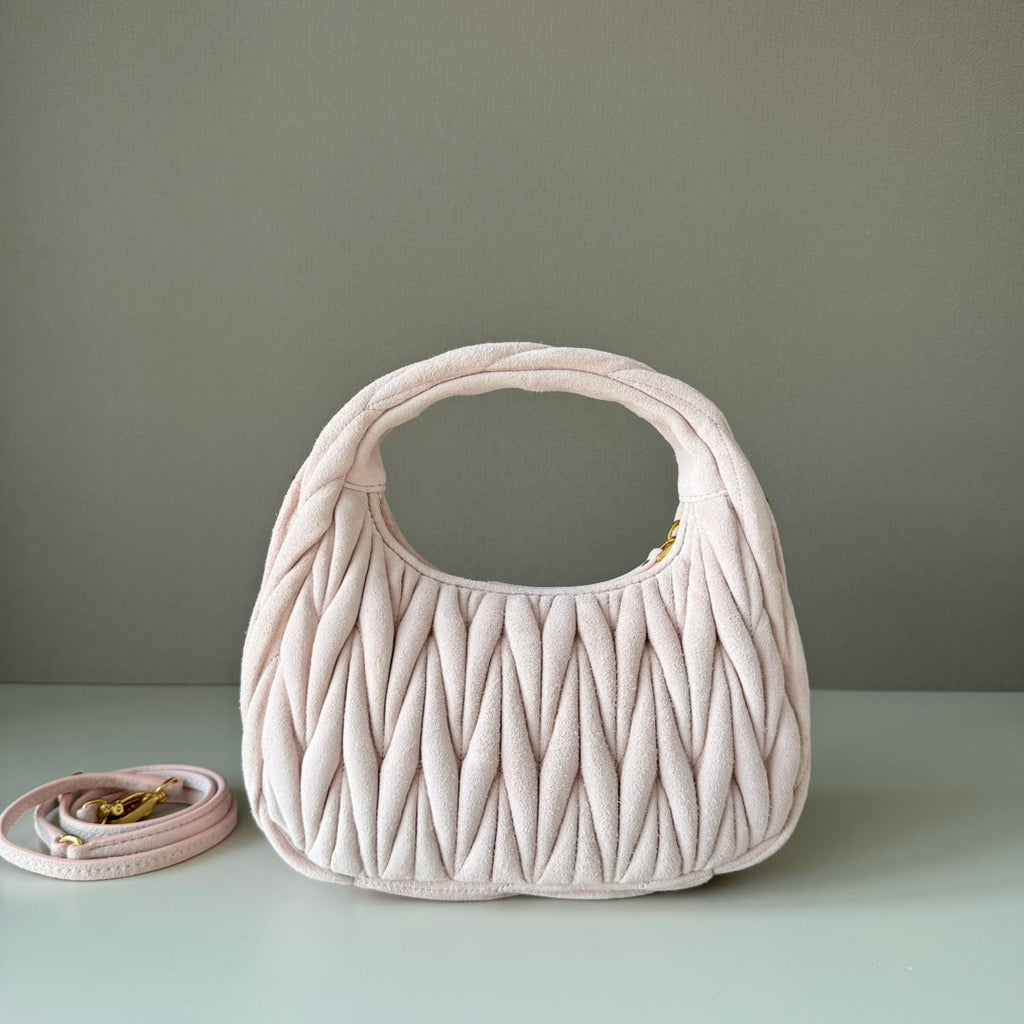 Light pink matelasse mini handbag with gold-tone logo and side view