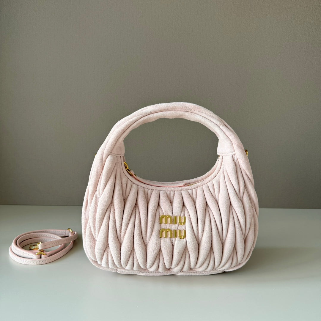 Light pink matelasse mini handbag with gold-tone logo and short top handle