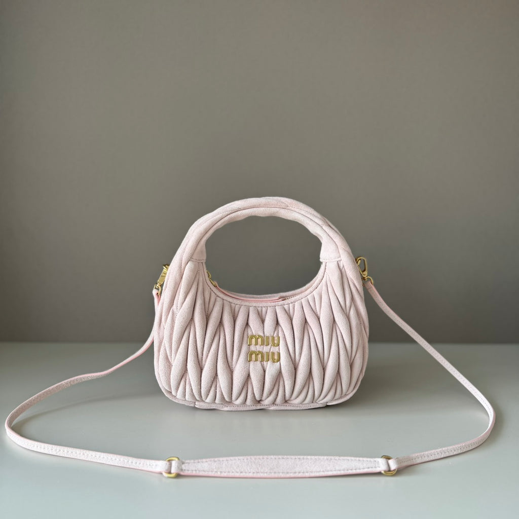 MiuMiu mini handbag in light pink matelasse with gold-tone logo and strap