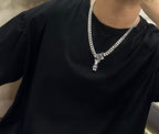 Louis Vuitton silver chain necklace with green V pendant and purple stone charms