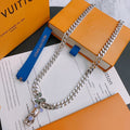 Louis Vuitton silver chain necklace with bear and charm pendant, purple accents