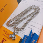 Louis Vuitton silver chain necklace with charm pendant, on card with blue insert