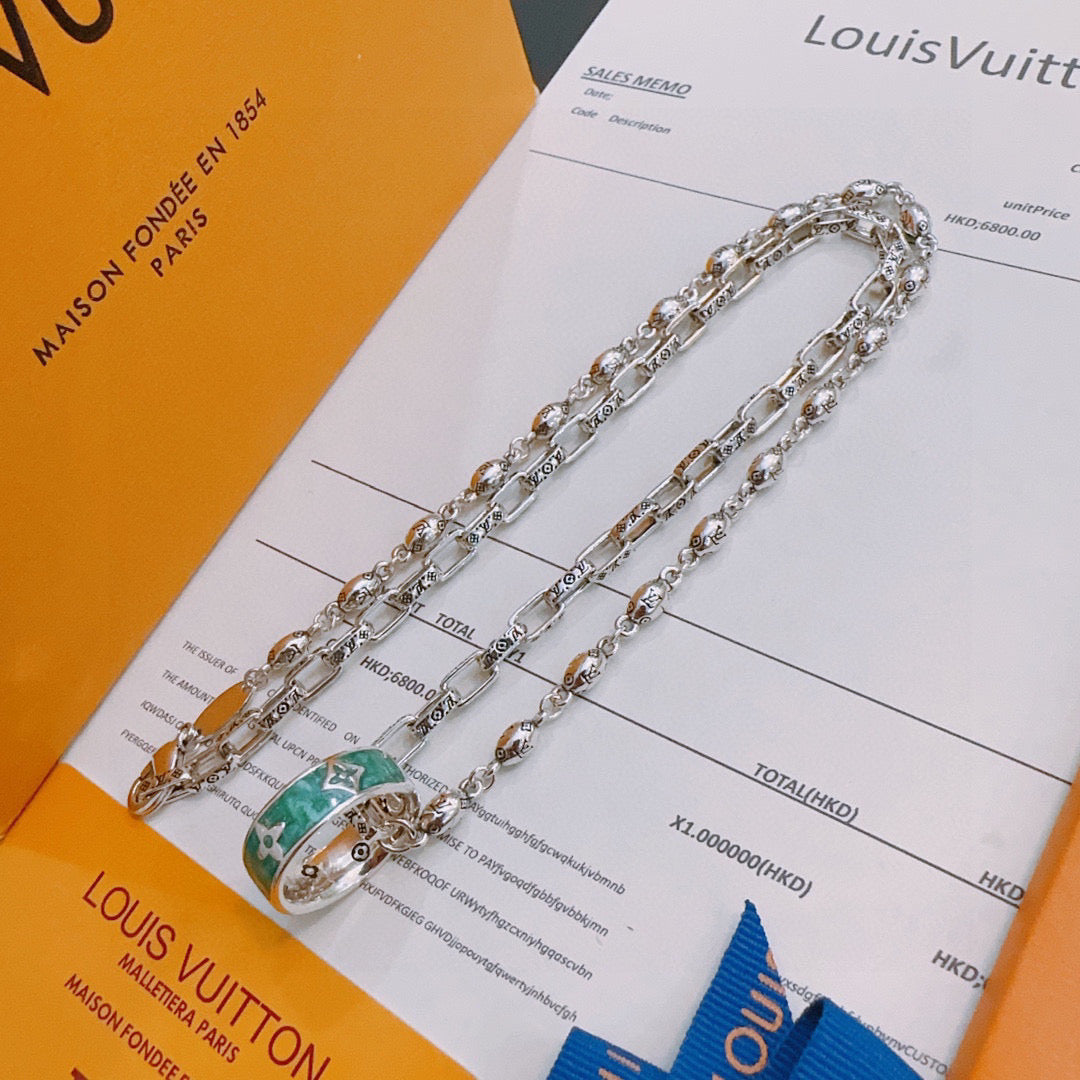 Silver-tone chain necklace with green and orange enamel pendant