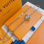 Silver-tone chain necklace with green and orange enamel pendant charm