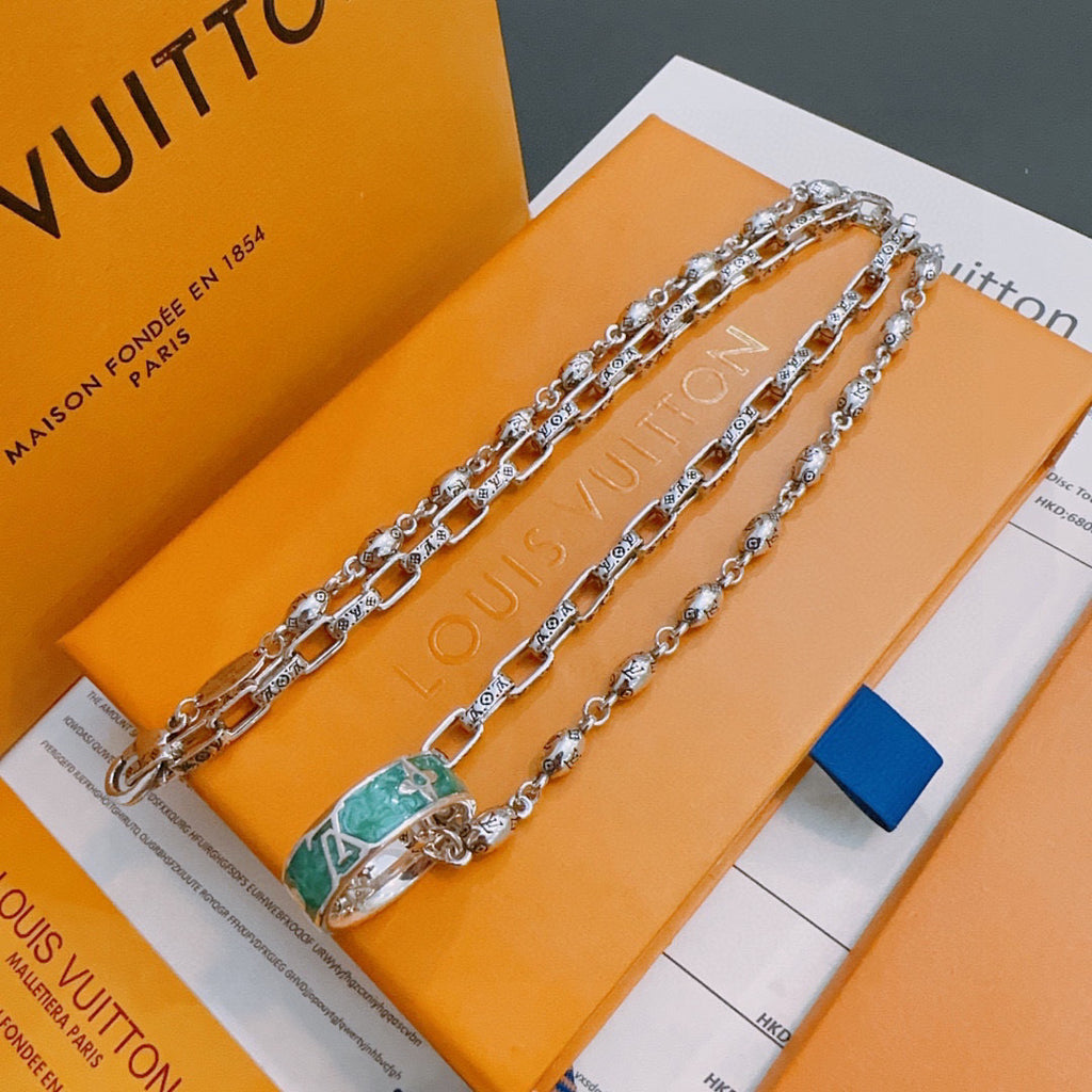 Silver-tone chain necklace with green enamel charm pendant