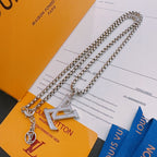 Silver-tone layered chain necklace with LV pendant and small charm pendants