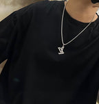 Silver-tone LV pendant necklace on a chain