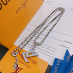 Silver-tone layered chain necklace with LV pendant and round charm