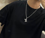 Silver-tone LV pendant necklace on a chain