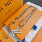 Silver-tone chain necklace with large LV monogram pendant and small charm