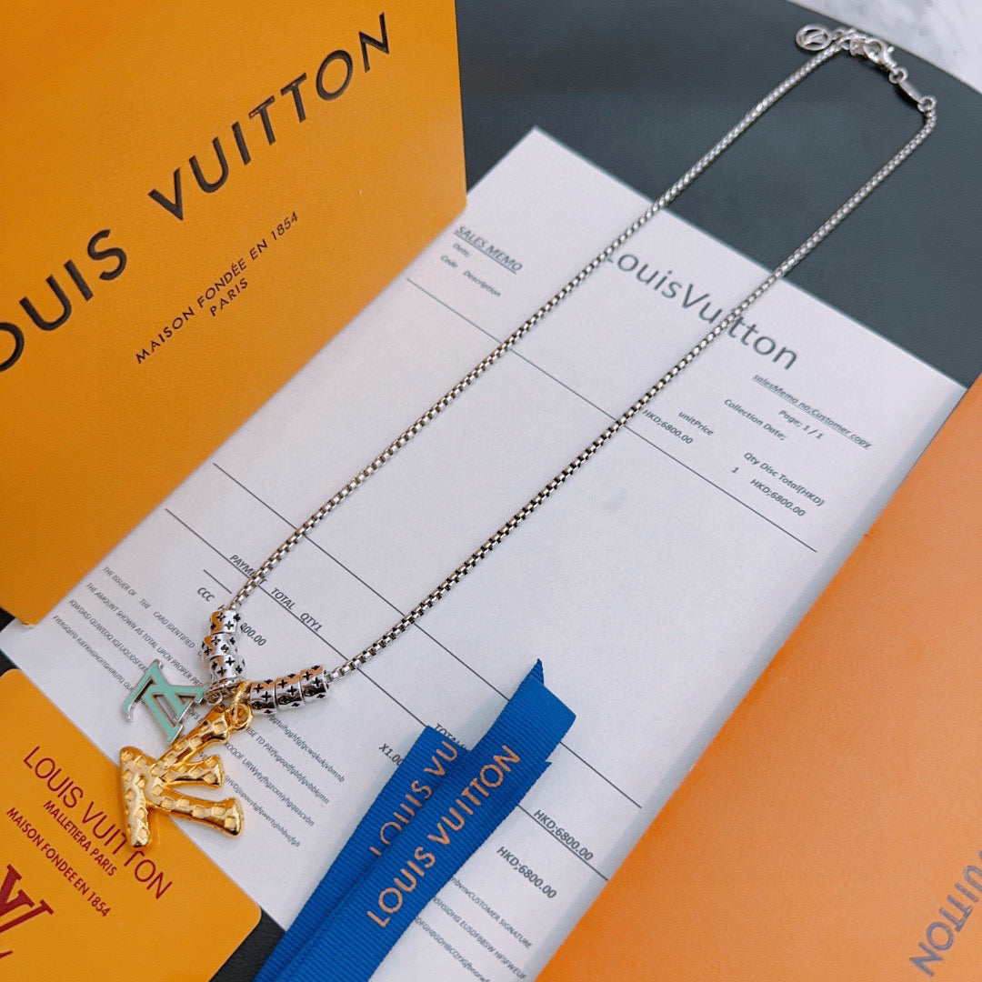 Louis Vuitton necklace with silver chain and gold pendant, shown with blue tag