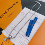 Silver-tone chain necklace with multicolor charm pendant and blue ribbon on cards.