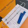 Silver-tone charm necklace with star and heart enamel pendants on chain