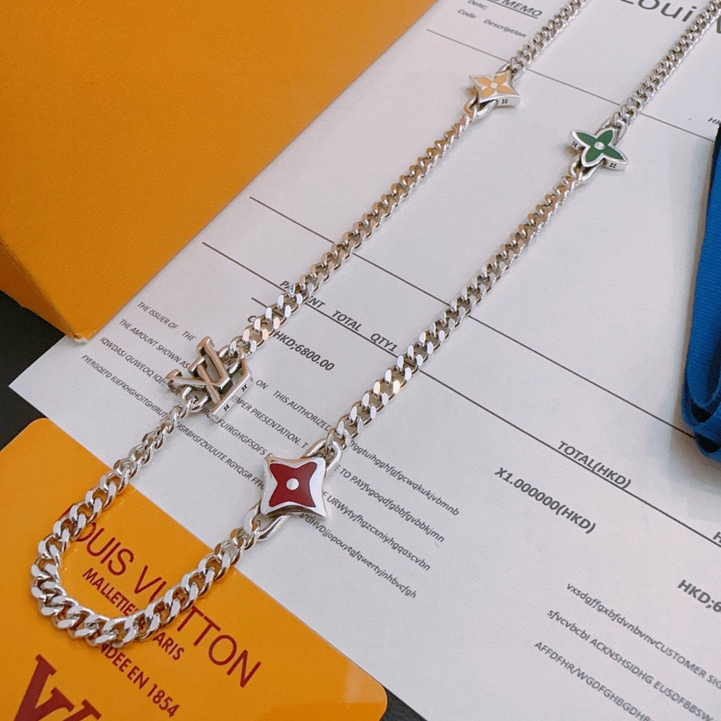 Silver-tone charm necklace with letter charm and red star enamel pendant