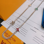 Silver-tone charm necklace with letter charm and red star enamel pendant