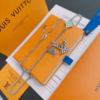 Silver-tone chain necklace with green star charm and multicolor letter pendant
